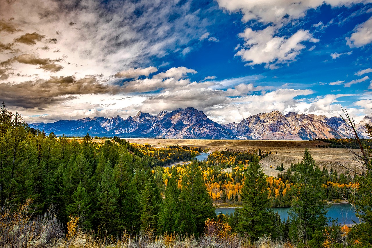 magestic mountains and a vast sky of clouds rolling in over Grand Teton National Park