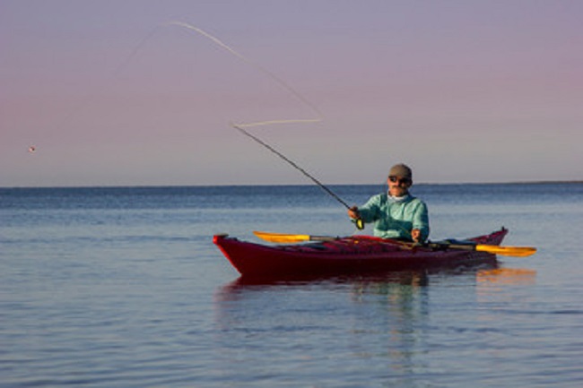 Man fly fishing from kayak in the Florida Everglades National Park