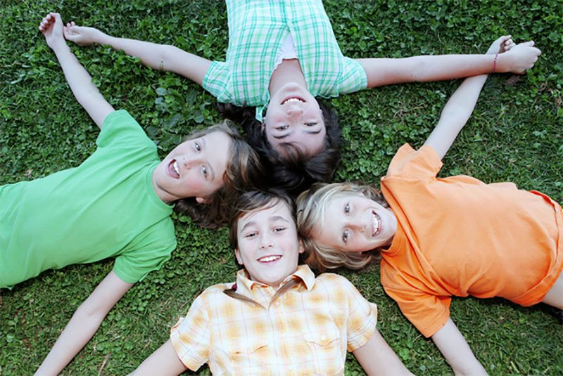 children lying on grass, Calaveras State Park